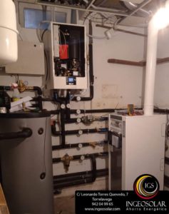 Sala técnica con caldera de gasóleo Wolf hibridada con aerotermia Wolf